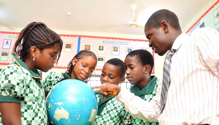 pupils reading globe